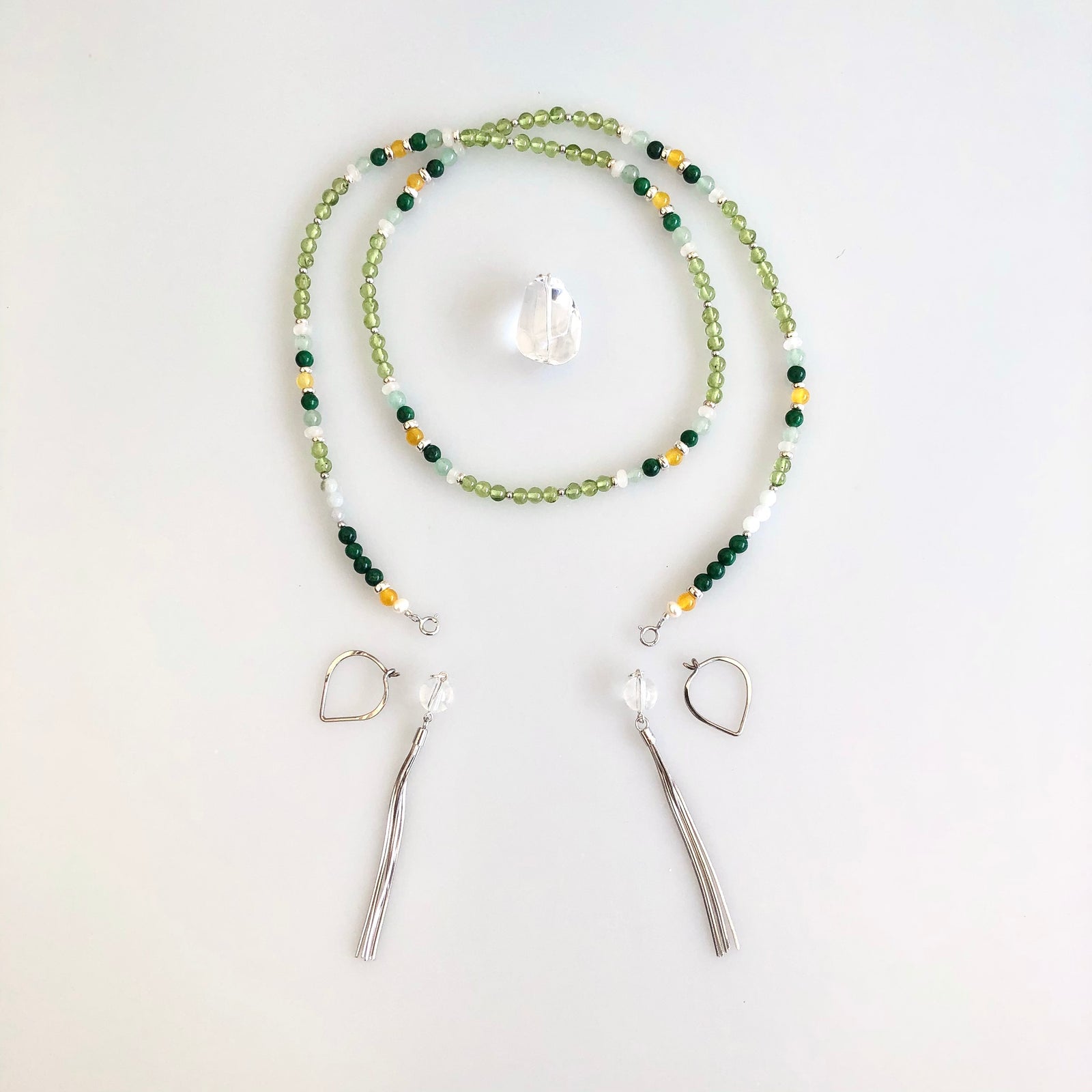 Yun Boutique, Asian Boutique Jewelry from New York. Multistyle, Peridot necklace, August Birthstone necklace, sterling silver necklace, lariat necklace, beaded necklace, green stone necklace, green crystal necklace, green beads necklace, long beaded necklace, crystal beads necklace, handmade necklace, gemstone necklace, crystal necklace for women, healing crystal necklace, real crystal necklace.