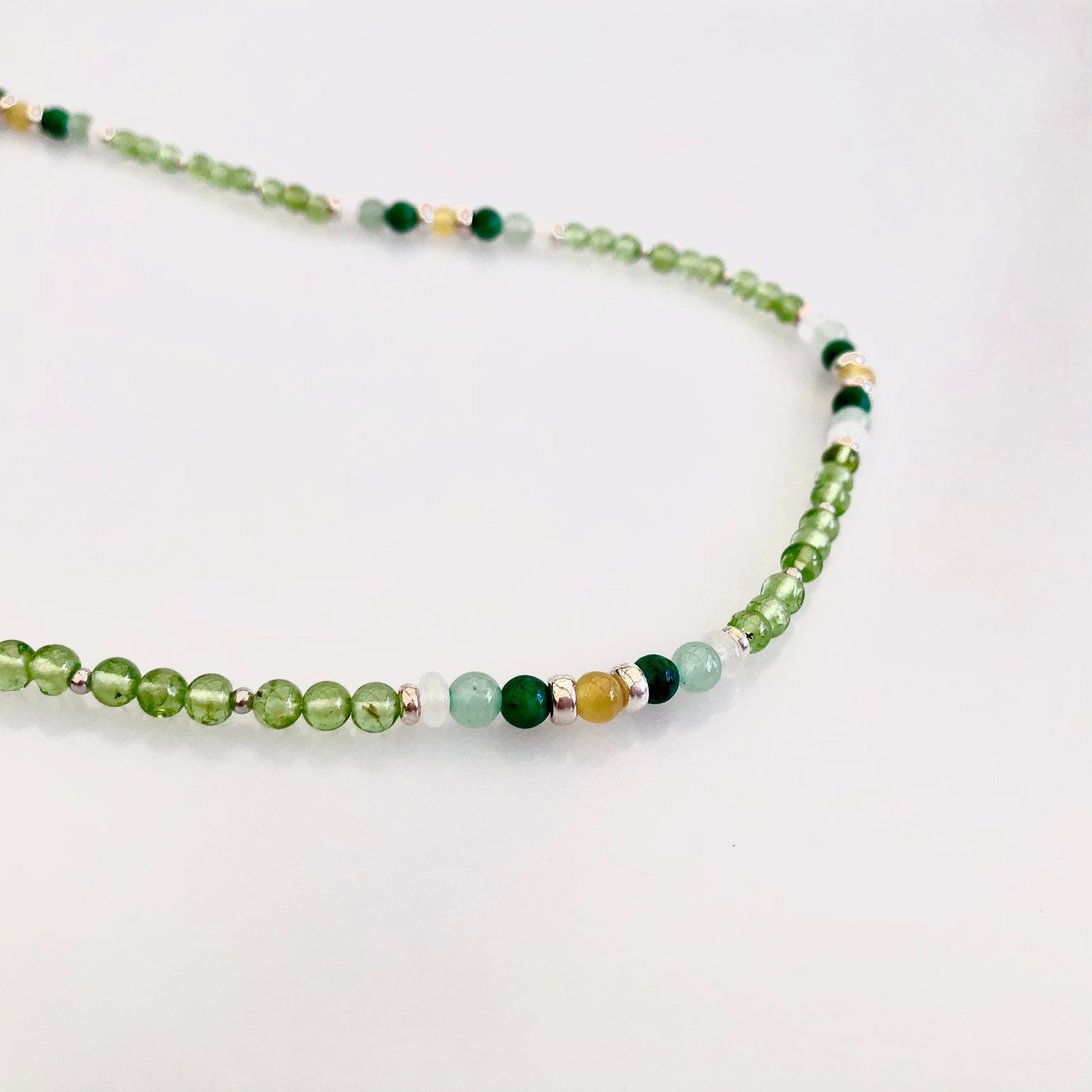 Yun Boutique, Asian Boutique Jewelry from New York. Multistyle, Peridot necklace, August Birthstone necklace, sterling silver necklace, lariat necklace, beaded necklace, green stone necklace, green crystal necklace, green beads necklace, long beaded necklace, crystal beads necklace, handmade necklace, gemstone necklace, crystal necklace for women, healing crystal necklace, real crystal necklace.
